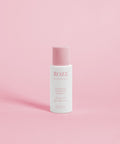mini glamorous volumizing szampon roze avenue na różowym tle